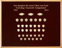 Donation board of the fire brigade of Knippelsdorf on red velvet for the flag of 2012