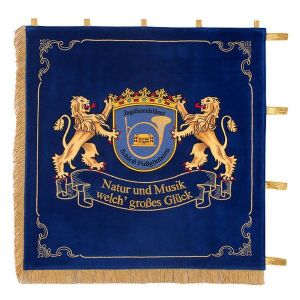 Standard of hunting horn players with elaborately embroidered lions, holding the club crest